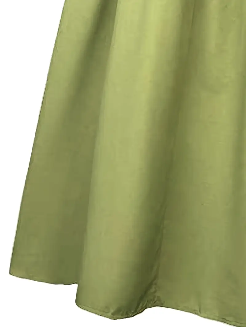 lśniący jasnozielony materiał dawnej sukni balowej