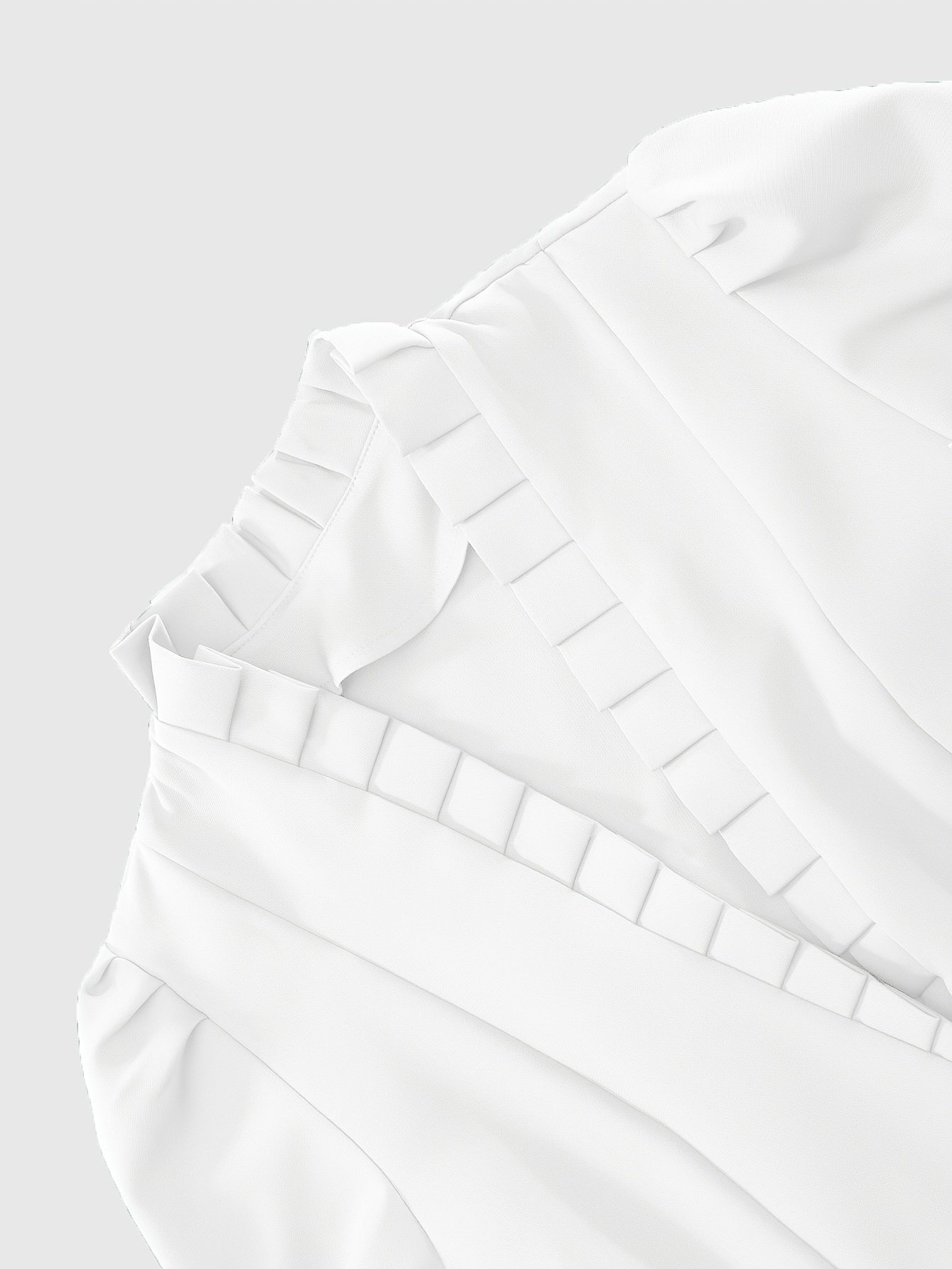 zbliżenie na materiał oraz falbanki białej damskiej kurtki peleryny